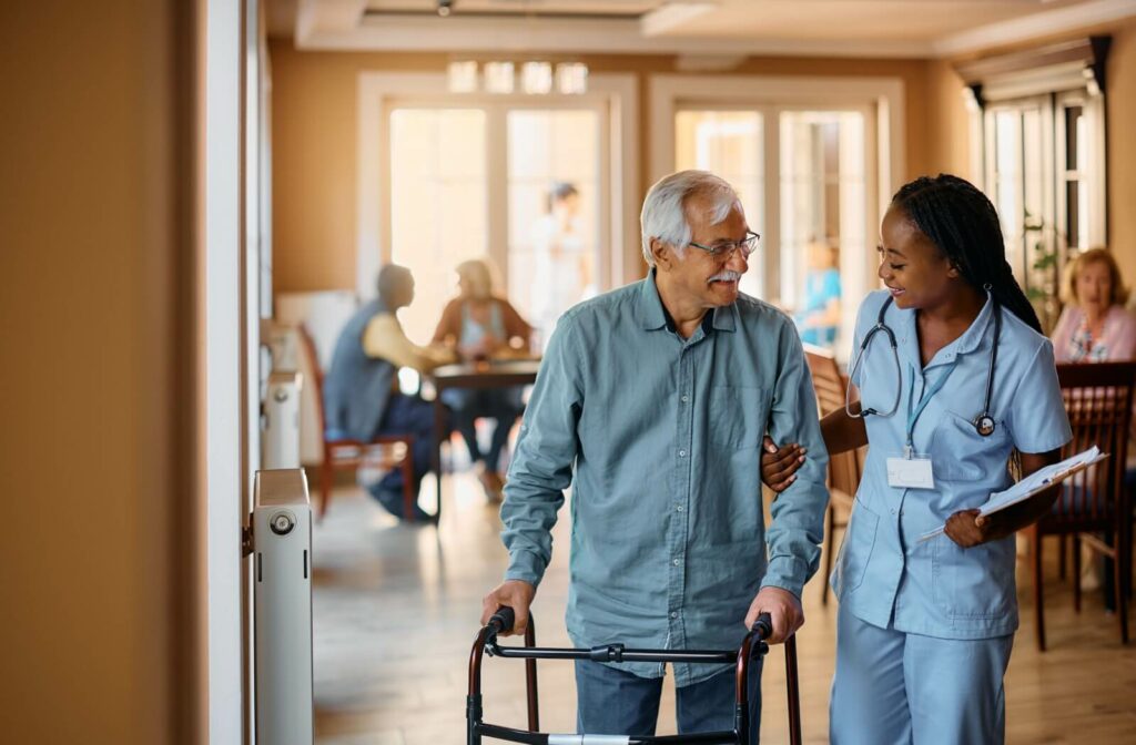 An assisted living staff member supporting a resident.